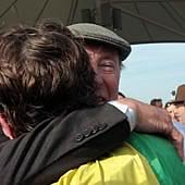 An emotional Trevor Hemmings hugs Jason Maguire in elation